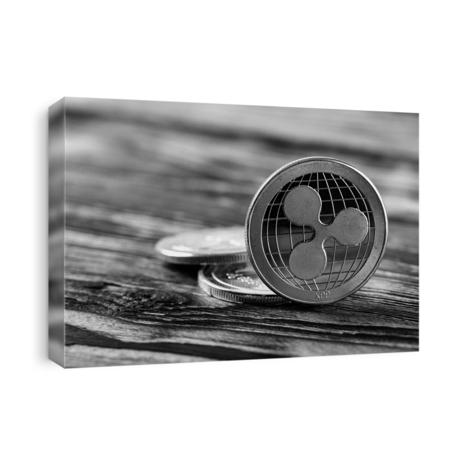 silver ripple xrp coins on a black wood background